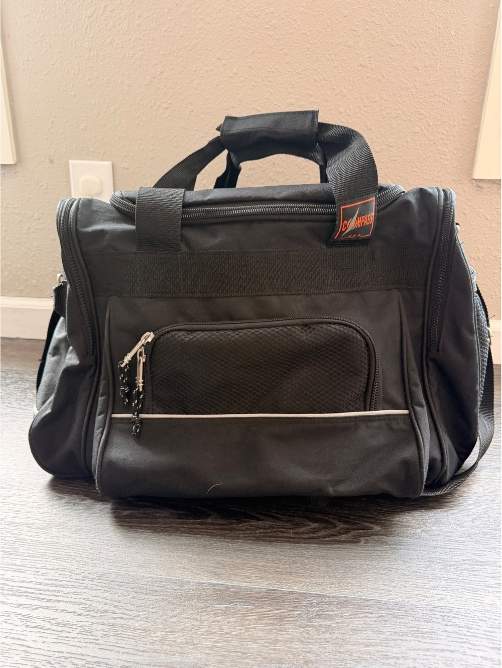Compass Black Durable Travel Duffel Bag with Multiple Zip Pockets and Carrying P
